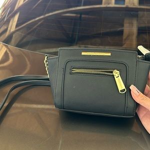 Cute small black Steve Madden purse.